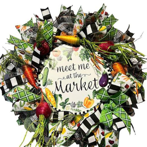 everyday wreath with a meet me at the market sign and veggies