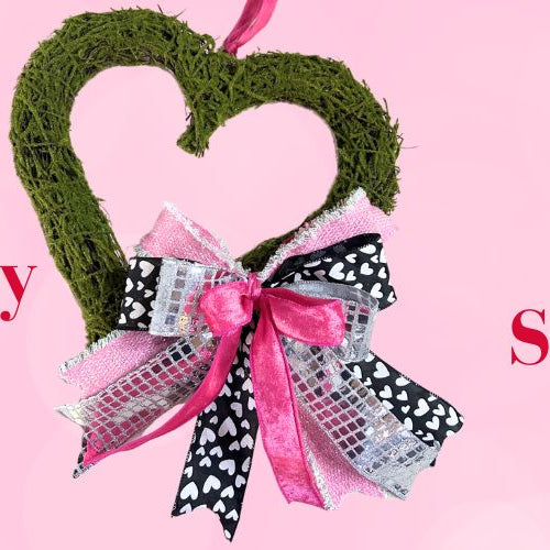 bow on a moss heart wreath