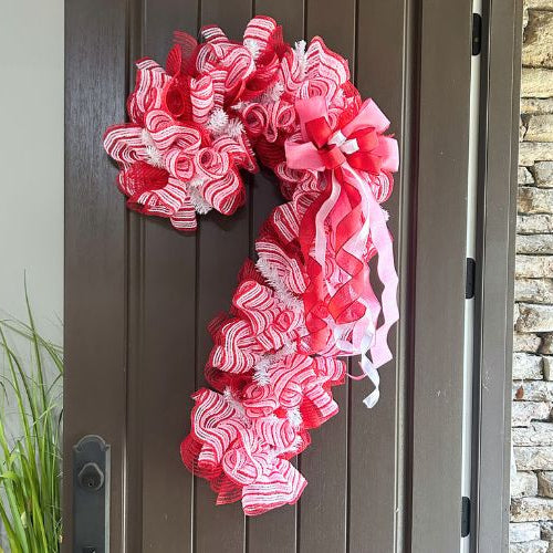 candy cane wreath made with our new pink, red, white, snow fuzz mesh