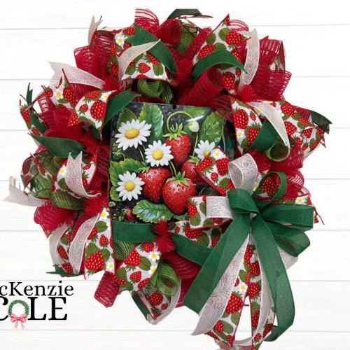 summer mesh wreath with a strawberries and white daisies sign