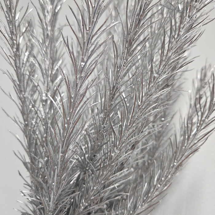 Close-up of silver metallic branches from a 16" Silver Christmas Salix 83552-SIL against a white background. The branches are adorned with shiny, reflective material, creating a frosty appearance reminiscent of an abstract winter or festive decoration.