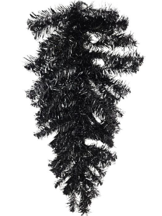 The 24 Halloween Teardrop Black 82298-BK hangs upside down against a white wall, featuring shiny black needle tinsel branches with no decorations.