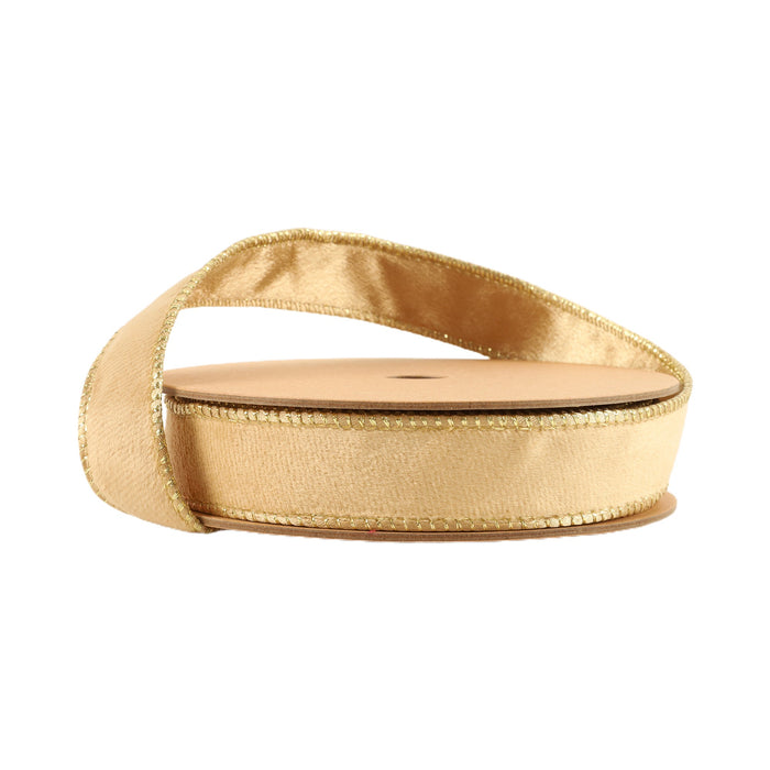 A partially unrolled spool of 1" Tan and Gold Reversible Classic Velvet Ribbon (7115W-835-25E) is displayed against a white background.