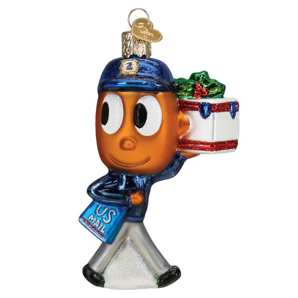 The USPS Mr Zip Old World Christmas Ornament 24231 features a smiling mail carrier in a blue uniform, holding a US Mail bag and wrapped gift, with a gold loop on top for hanging.