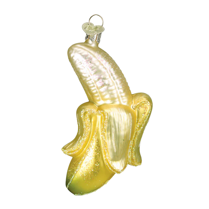 The Peeled Banana Ornament from Old World Christmas (28066) is a hand-blown glass ornament shaped like a partially peeled banana, featuring shiny gold and yellow hues with a loop at the top for hanging.