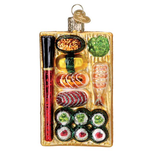 The Sushi Platter Old World Christmas Ornament 32649 features a sushi bento box with assorted sushi pieces, shrimp, green garnish, and red chopsticks on a golden tray, plus a loop for hanging.