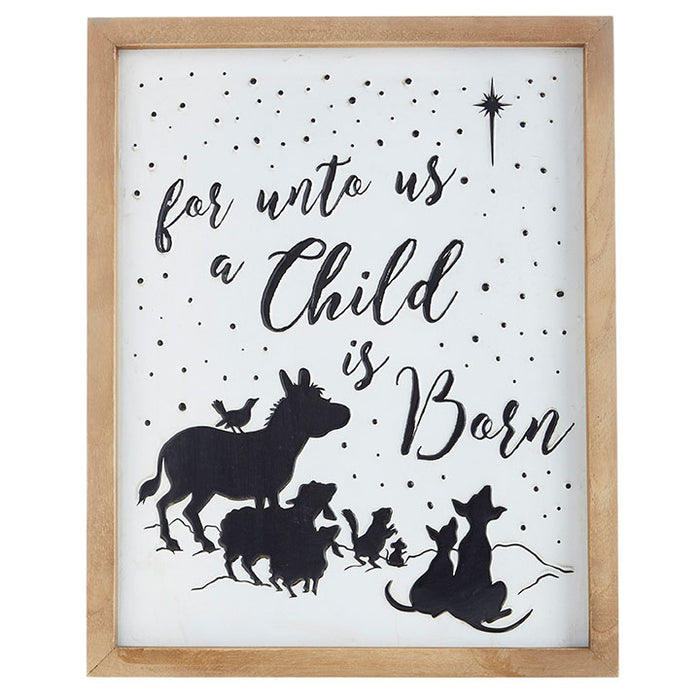The 18 A Child Is Born Wall Art 4012325 displays nativity animal silhouettes and a star, with For unto us a Child is Born above wood and paper details. Small dots evoke a night sky with the shining star above.