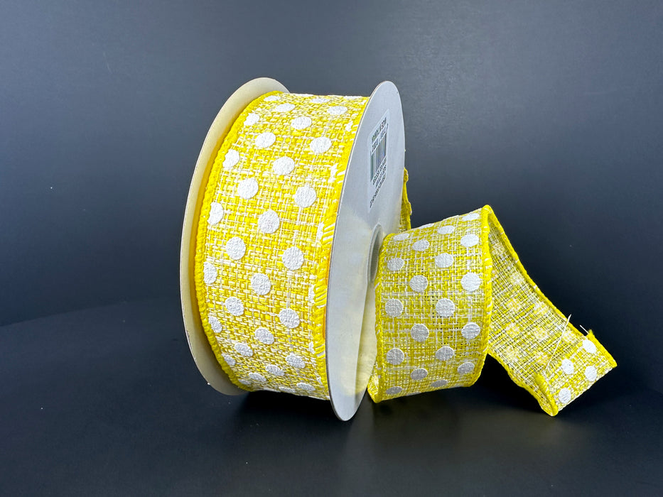 The 1.5X10Y Yellow White Tweed Small Dots Ribbon 41505-09-22, vibrant yellow with white polka dots, is shown against a dark background. The wired edge is slightly unraveled, highlighting its detailed texture similar to tweed.