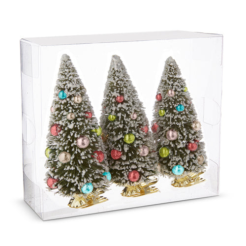 A clear box displays three 6 clip-on bottle brush tree ornaments (4215552), each with white-tipped branches, colorful decorations, and a gold base.
