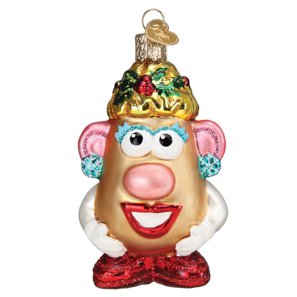 The Mrs Potato Head Old World Christmas Ornament 44201 features a gold festive hat with holly, blue eye shadow, red lips, white gloves, red shoes, and a gold hanging loop.
