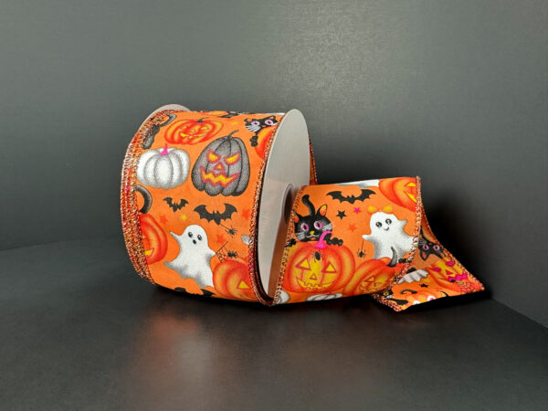 The 2.5X10Y Orange Satin/Vintage Halloween Ribbon 51519-40-19, decorated with ghosts, pumpkins, bats, black cats, and stars, is displayed against a plain dark background.
