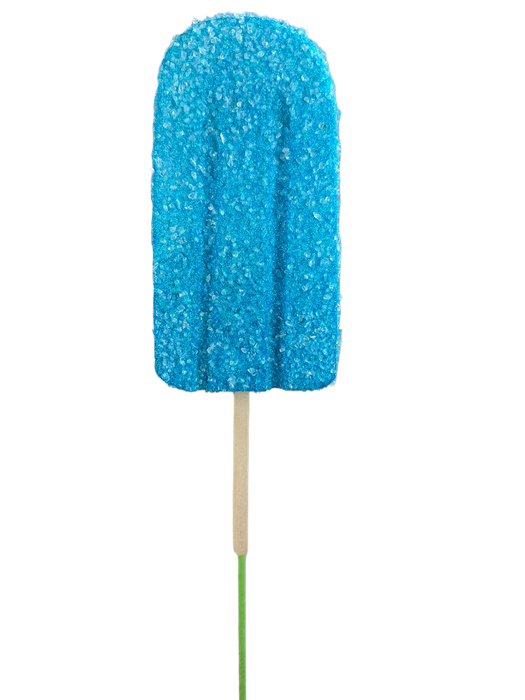 A popsicle embellished with sugar crystals, featuring a vibrant blue hue, is perched on a 20" by 4" Blue Popsicle Pick 63396BL against a simple backdrop.