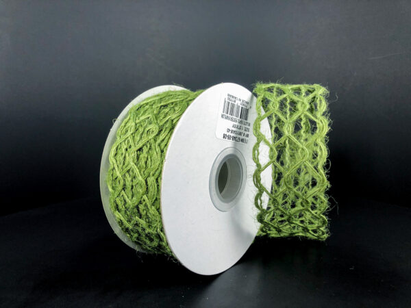 The 1.5X10Y Green Ms Green Scallop Weave Burlap Ribbon (67348-09-08) rests against a dark background, partially unwound to display its net-like scallop weave pattern and fibrous green material.