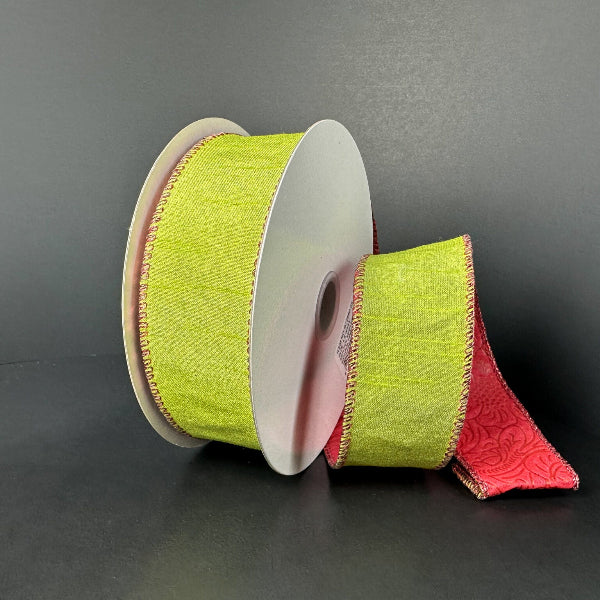 Two spools of 1.5x10y double sided lime dupioni/red glitter emboss ribbon (D73580-09-09) feature light green with red decorative edges, a red reverse embossed with a floral pattern, all shown on a black background.