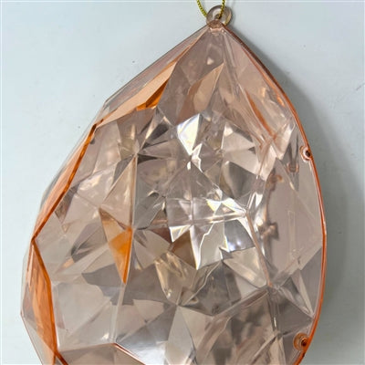A 6.3" x 4" x 9" Rose Gold Plastic Drop Ornament (DCORN5408RS) with a faceted, teardrop shape hangs by a small metal loop against a plain white background.