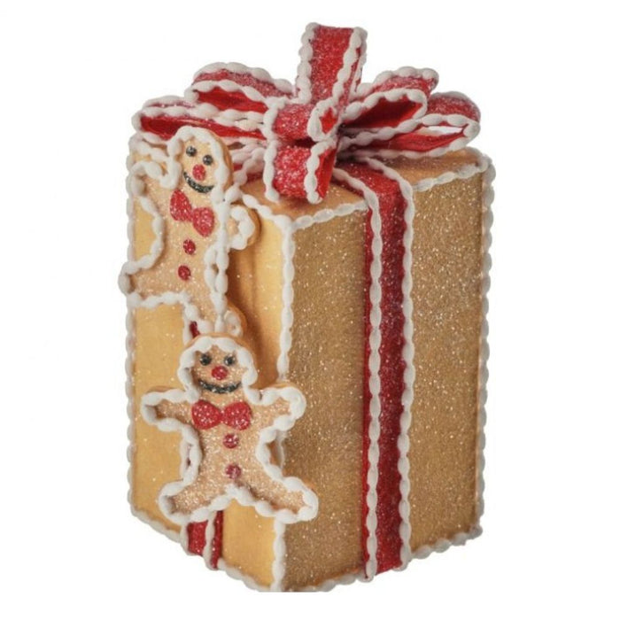 Decorative gingerbread-themed gift box with a red ribbon on a white background