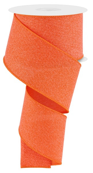 A partially unwound 2.5X10YD Orange Crystal Shine Ribbon RGE199520 drapes in a spiral shape against a white background.