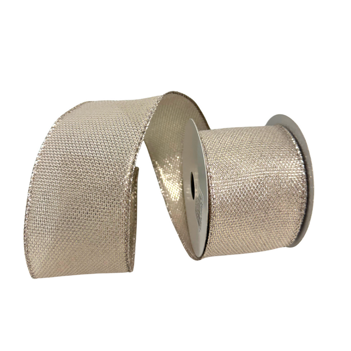 Two rolls of 2.5 x 10 Yard Solid Champagne Ribbon (TT2340-108), one upright and partly unspooled, the other lying flat, both with a textured, shiny finish—ideal as festive Christmas ribbon against a white background.
