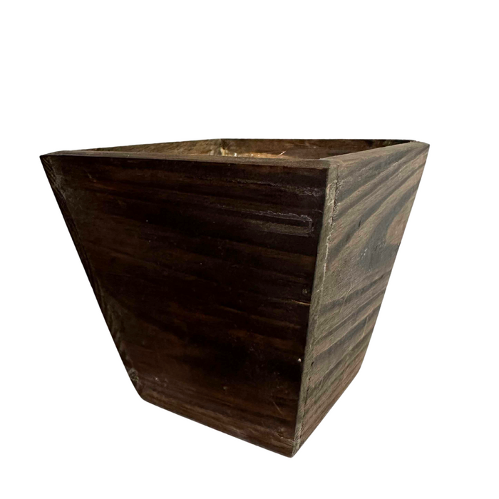 The 6 Natural Wood Square Pot WD384N features a dark finish with visible wood grain and a slightly tapered design. This minimalist, empty planter measures 6 x 6 x 6 and offers a rustic charm, standing out beautifully against a white background.