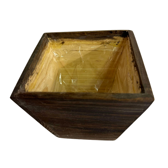 The 6 Natural Wood Square Pot WD384N is a dark-finished wooden planter box with dimensions of 6 x 6 x 6. It features a hollow interior, visible wood grain, and clear plastic lining for waterproofing.