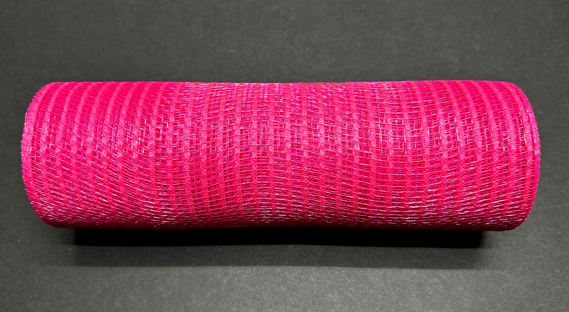 A roll of 10"X10Y Fuchsia Breeze Solid Mesh Mesh XB240710-28 is laid horizontally on a dark surface, highlighting the texture and typical weave pattern of solid mesh material.