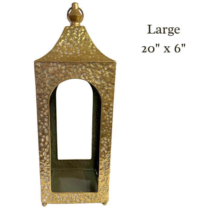 A gold hammered metal artisan lantern with an open arched front and a top loop, available in 20 x 6 and 16 x 5 sizes (M32600AB). Text on the right reads Large 20 x 6.