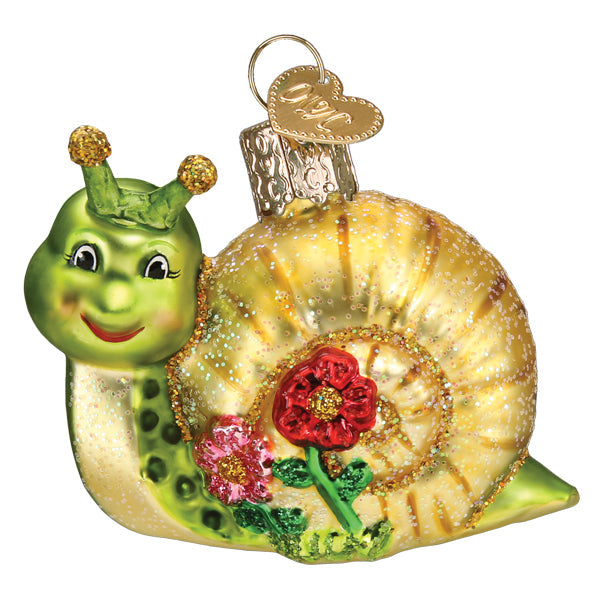 The Smiley Snail Ornament by Old World Christmas (12644) features a green body, glittery gold shell with red and pink flowers, a cheerful face, and a gold loop for hanging—perfect for adding joy to your tree and celebrating slow life lessons.
