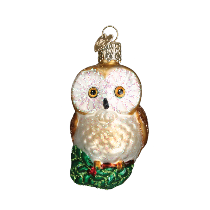The Christmas Owl Ornament (Old World Christmas Ornament 16094) is a charming piece featuring wide eyes, brown wings, and a white chest. Perched on a green base with a gold loop for hanging, it adds festive charm to your holiday season décor.