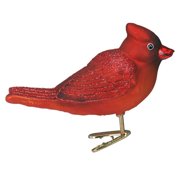 The Bright Red Cardinal Ornament from Old World Christmas (18139) features glittery wings and tail, plus a metal clip on the bottom for easy placement.