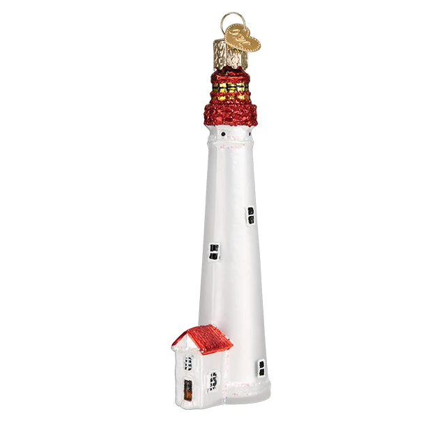 The Cape May Lighthouse Old World Christmas Ornament 20115 features a white lighthouse and attached building with red roofs, black windows, glitter accents, and a gold hanging loop.