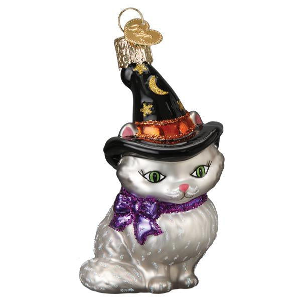 The Witch Kitten Ornament Old World Christmas Ornament 26089 features a white cat in a black witch hat with gold stars, a crescent moon, and a sparkly purple bow—an enchanting decoration perfect for Halloween or any festive occasion.