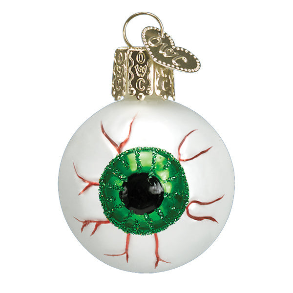 The Green Evil Eye Ornament by Old World Christmas (26091) features a green iris, red veins, and a gold cap with loop—combining quirky Halloween charm and festive holiday spirit in one unique Christmas tree ornament.