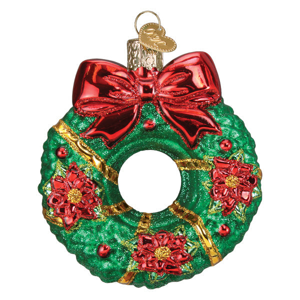 The Christmas Wreath Old World Christmas Ornament 36314 is a hand-painted glass ornament featuring a shiny green wreath, big red bow, red flowers, gold ribbons, and a gold hanging loop in classic Old World style.