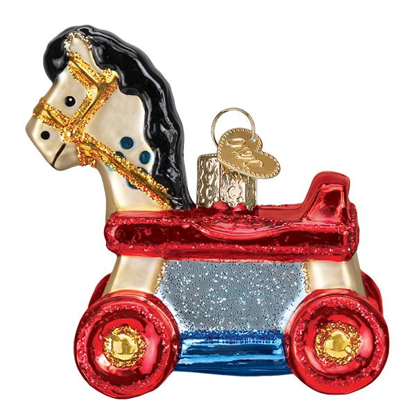 The Rolling Horse Toy Ornament Old World Christmas Ornament 44131 is a decorative piece featuring a horse on red wheels, with a metallic gold mane and accents, glittery blue sides, and a gold hanging loop.