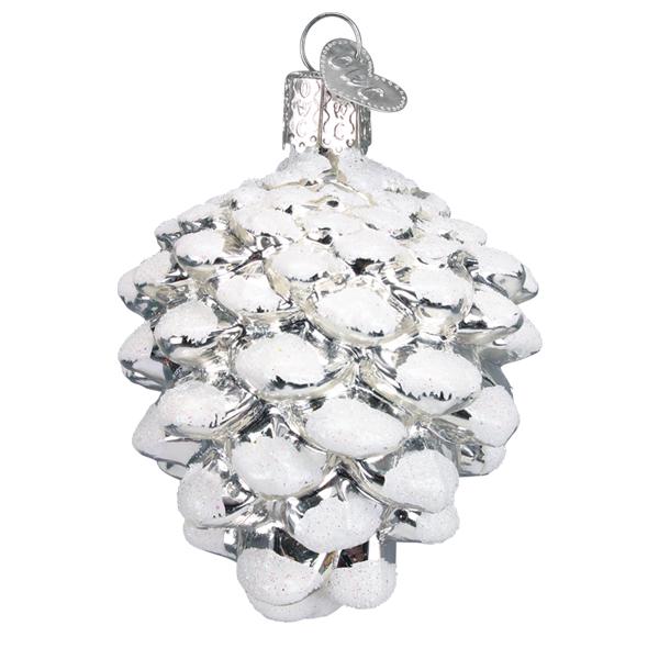 The Snow-capped Silver Snowy Cone Ornament by Old World Christmas (48043) is a glass pine-cone ornament with white glitter and a metal cap, perfect for adding sparkle to your Christmas tree.