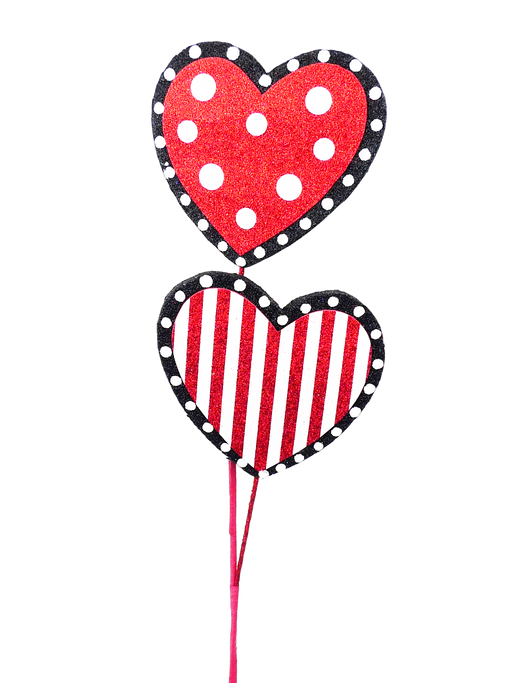 The 24" Red White and Black Polka Dot Stripe Heart Spray with 2 Stems features two heart-shaped decorations: the top one adorned with white polka dots and the bottom with vertical white stripes. Both hearts are highlighted by a black border with white dots, beautifully connected by red stems.