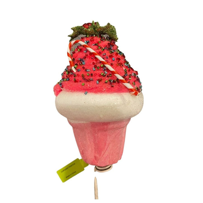 The 16 Cupcake Christmas Pick 84260PK features a pink and white Styrofoam cupcake with red sprinkles, a glittery green holly leaf, red berry, and striped candy cane—perfect for festive holiday displays.