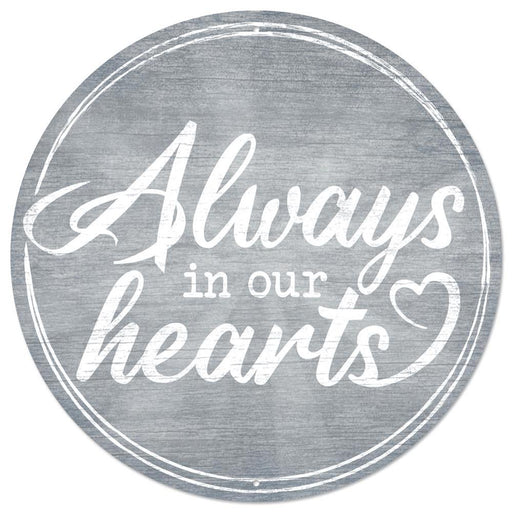 The 12Dia Metal Always In Our Hearts Sign in smoke blue and white (MD1005) features elegant script text with a heart shape—a beautiful, heartfelt memorial for any space.