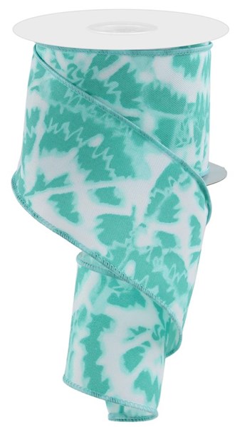 A partially unrolled spool of the 2.5X10Yd Soft Tie Dye On Diagonal White/Teal RGE124134 ribbon reveals a teal and white zigzag pattern, coiled in a spiral to exude texture and movement.