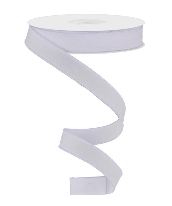A spool of 5/8X10Yd Shimmer Glitter White ribbon unrolls downward in a loose spiral against a plain white background.