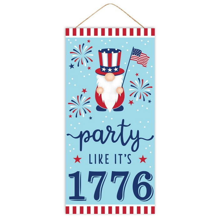 The 12.5 Party Like Its 1776 Sign AP7096 features a patriotic gnome with a stars-and-stripes hat holding an American flag, fireworks in the background, and a bold Party like its 1776 message accented by red and white stripe borders.