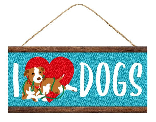 The 12.5”Lx6”H I Heart Dogs Sign (AP7127) features I ♥ DOGS, a white/brown dog with a green leash, and hangs from twine—perfect for any dog lovers home décor.
