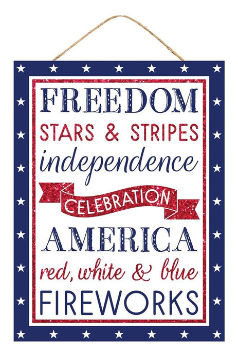The 15.75H x 11.75L Freedom America Sign (AP8805) features Freedom, Stars & Stripes, Independence, Celebration, America in bold red, white, and blue on a white backdrop with a charming blue border adorned with white stars and red glitter accents.