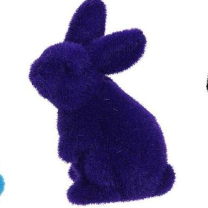 A 6Hx3.5L flocked standing rabbit figurine in purple, made from polystyrene and nylon, is sitting upright against a white background.
