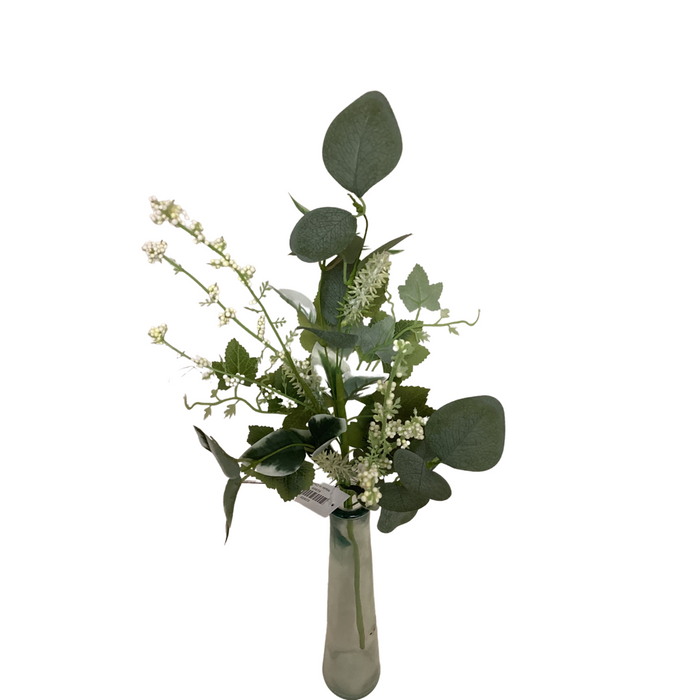 A small glass vase holds the 19 Mixed Green Pick 62853 with white artificial flowers, displayed against a plain white background.