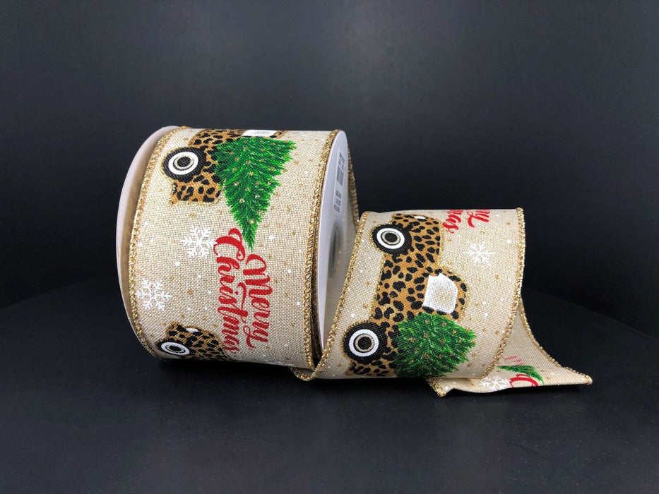 Two rolls of Natural Linen/Cheetah Christmas Truck 2.5X10Y Ribbon feature a leopard print truck with a green Christmas tree, white snowflakes, Merry Christmas in red on beige linen, edged with gold glitter.