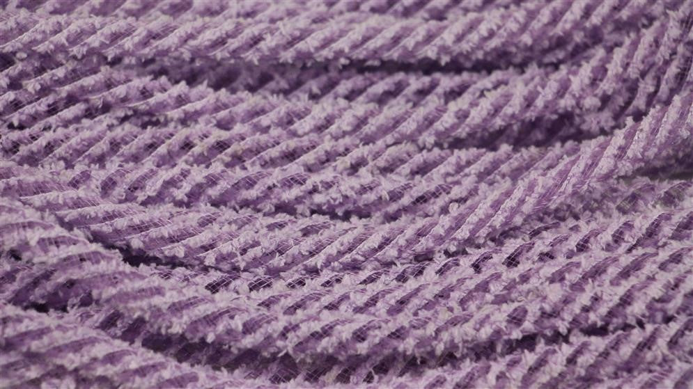 Close-up of 8Mm X 20Yd Snowdrift Deco Flex Tubing in Orchid (RE322495), with multiple twisted cords arranged in wavy, parallel rows for a repetitive pattern.