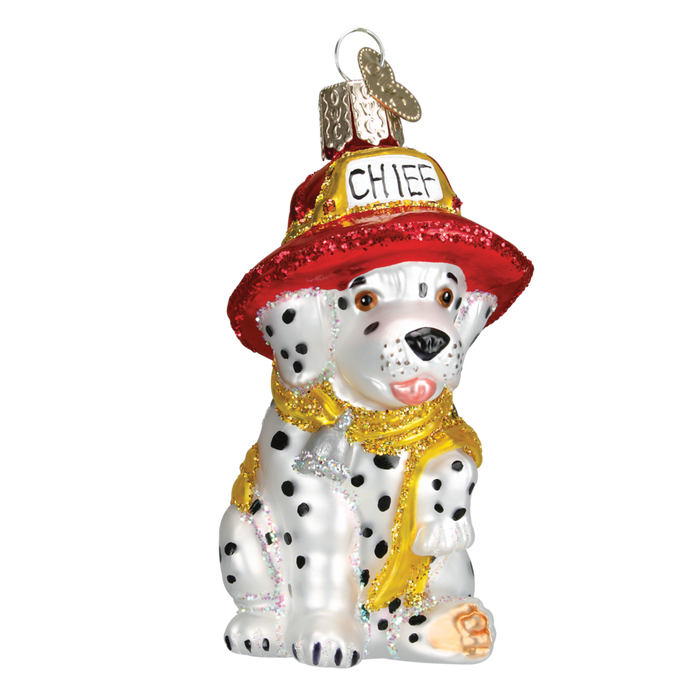 The Dalmatian Pup Old World Christmas Ornament 12208 is a hand-painted glass piece featuring a Dalmatian in a red CHIEF firefighter hat and yellow scarf, accented with glitter for festive sparkle.