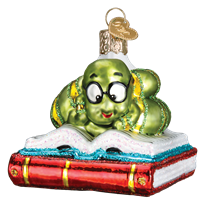 The Bookworm 12514 Old World Christmas Ornament features a shiny green cartoon bookworm with glasses atop an open book on a closed red one. This decorative blown-glass ornament includes a gold cap and loop for hanging.