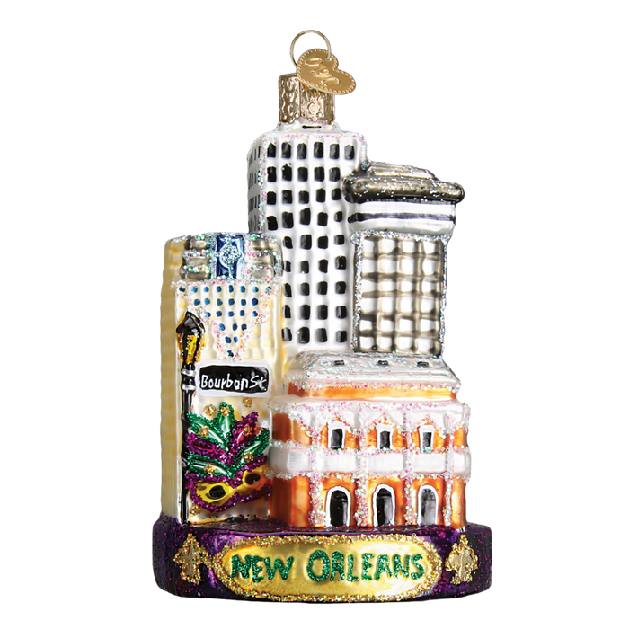 Celebrate Mardi Gras year-round with the New Orleans 20089 Old World Christmas Ornament, a glittery hand-painted glass keepsake featuring city landmarks, a Bourbon St sign, Mardi Gras mask, and New Orleans at the base.